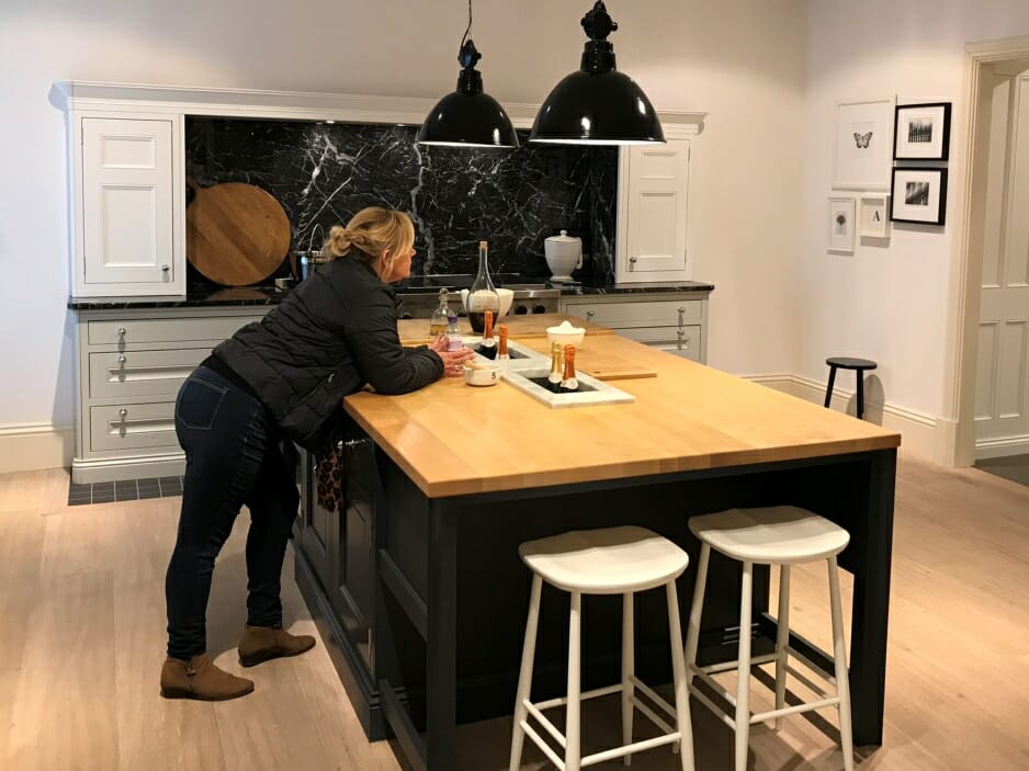 Customer admiring her Mastercraft Bespoke Fitted Kitchens after financing