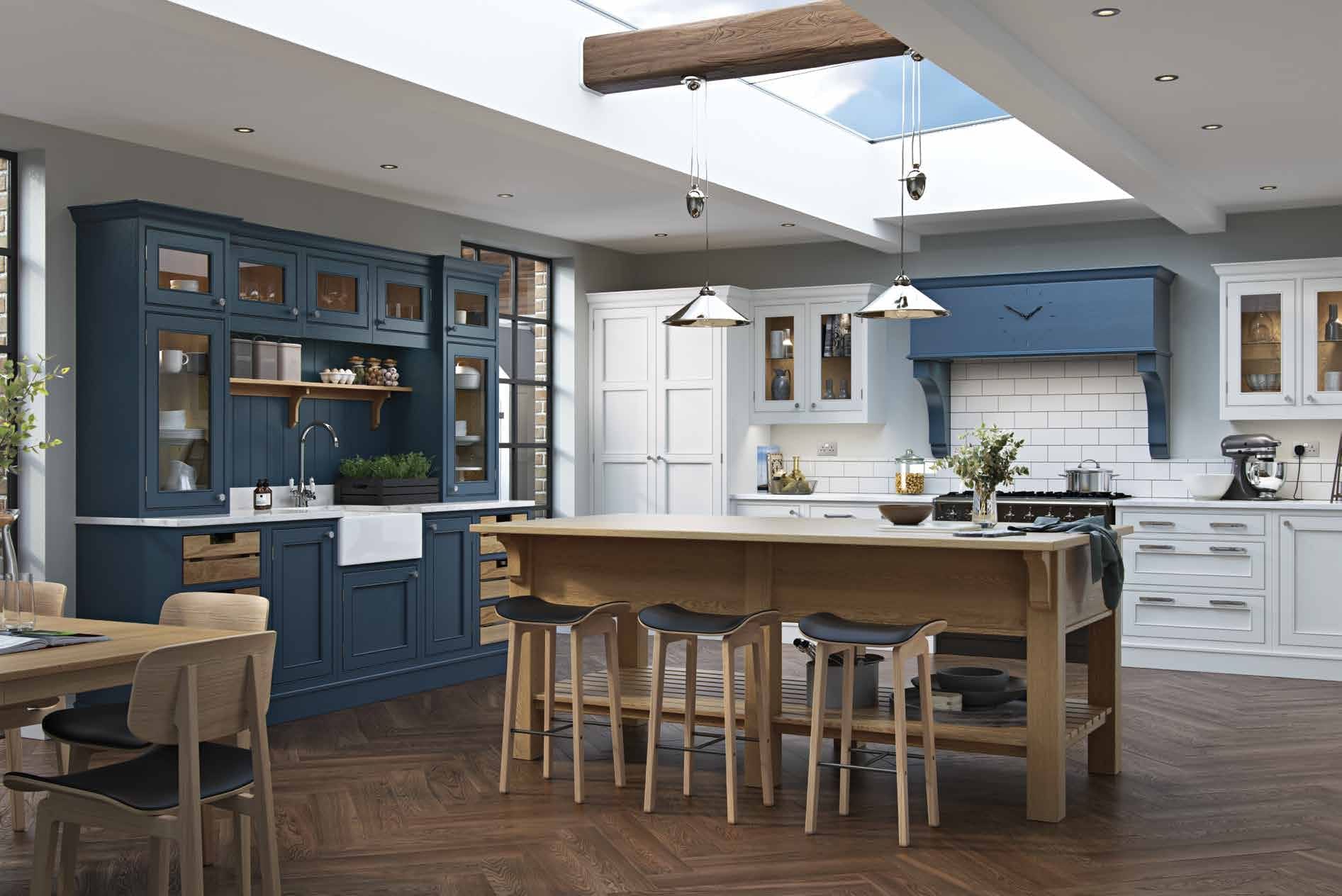 Bespoke fitted kitchen installation in Anglesey featuring a large island, painted shaker cabinetry, and integrated appliances by Mastercraft Kitchens.